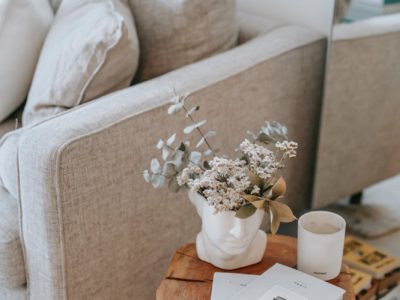 living room interior with furniture and flowers in vase