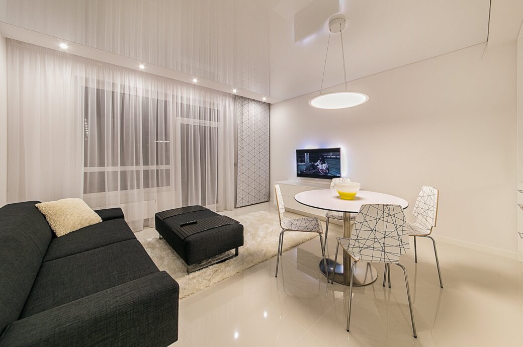 black fabric sofa near round white table